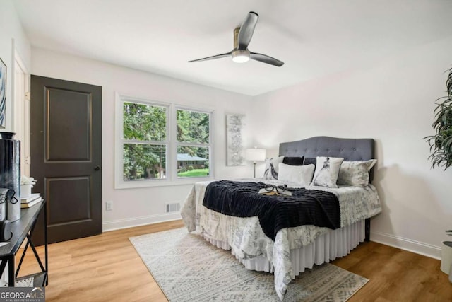 bedroom featuring hardwood / wood-style flooring and ceiling fan