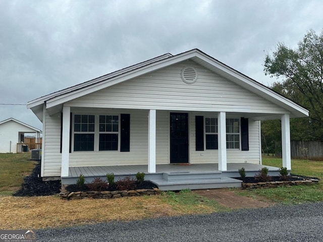 view of front of house with cooling unit and covered porch