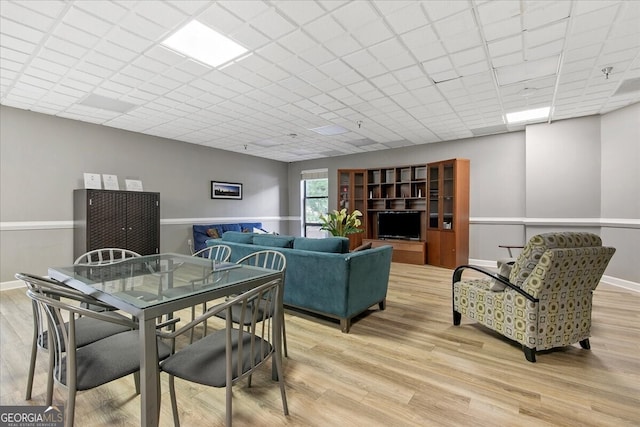 dining space featuring light wood-type flooring