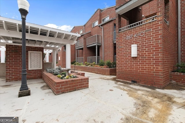 view of patio / terrace with a balcony