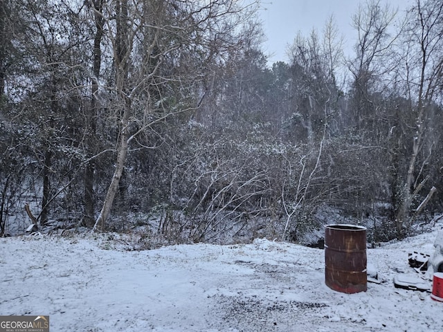 snow covered property featuring covered porch