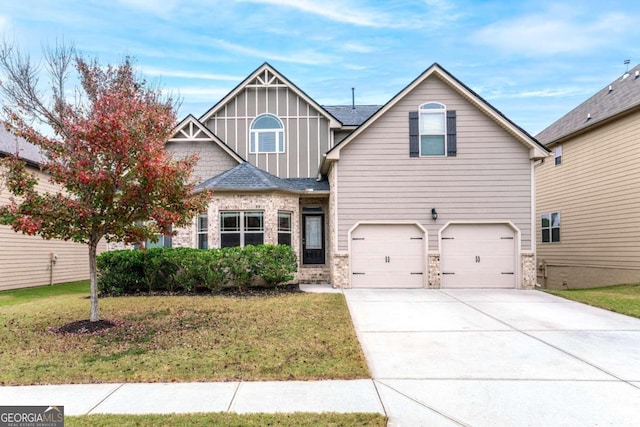 view of front of property with a garage and a front yard