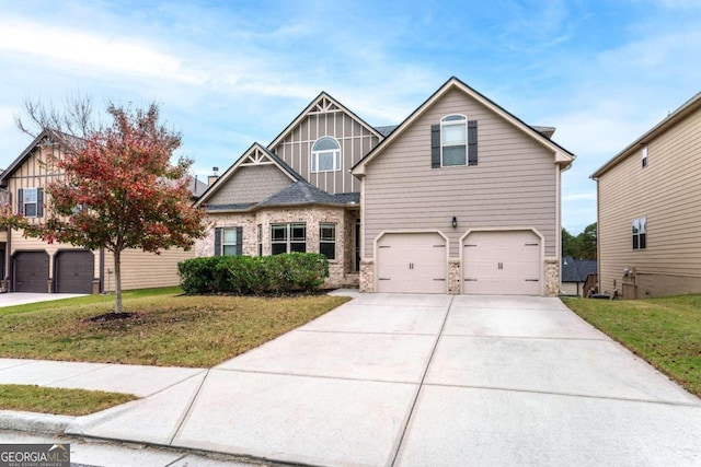 view of front of home with a garage and a front lawn