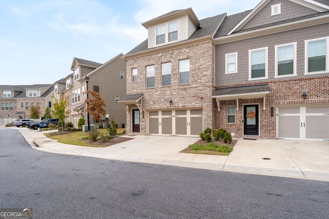 multi unit property featuring a garage