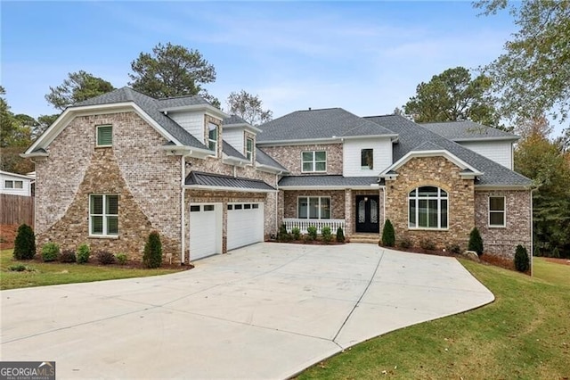 craftsman inspired home featuring a garage and a front yard