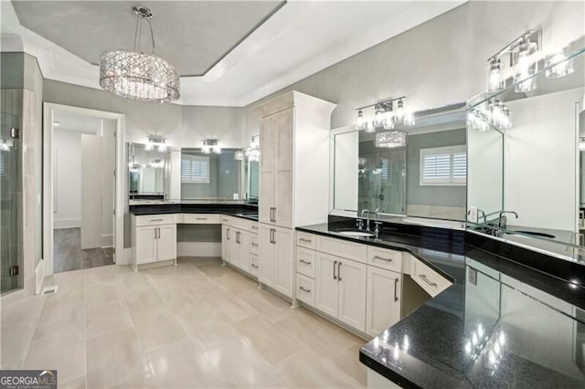 bathroom with walk in shower and vanity