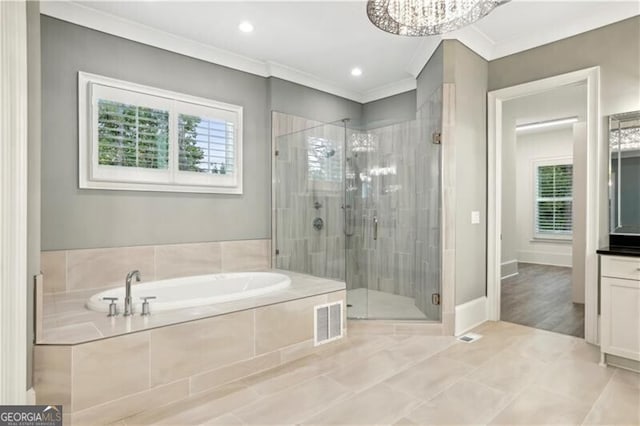 bathroom with independent shower and bath, vanity, a notable chandelier, and crown molding