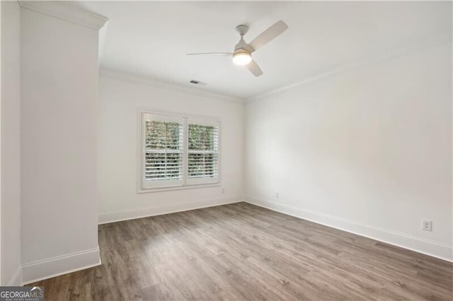 unfurnished room featuring hardwood / wood-style floors, ceiling fan, and ornamental molding