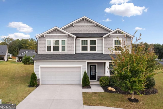 craftsman-style home with a garage and a front lawn