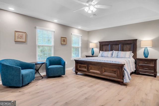 bedroom with ceiling fan and light hardwood / wood-style floors