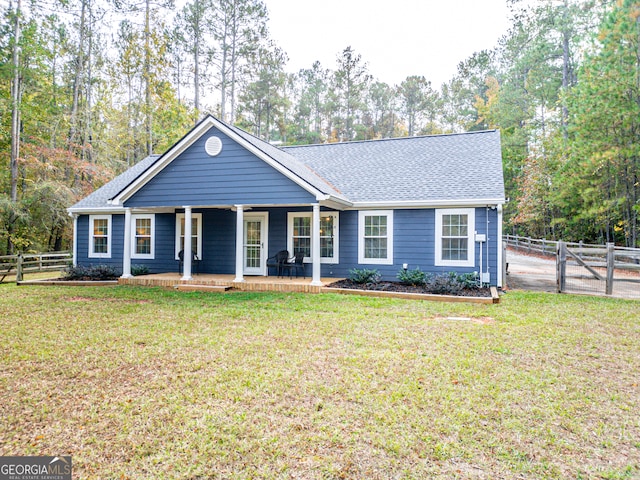 ranch-style house featuring a front yard and a porch