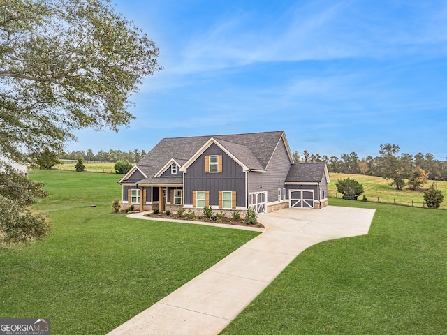 view of front of house with a garage and a front yard