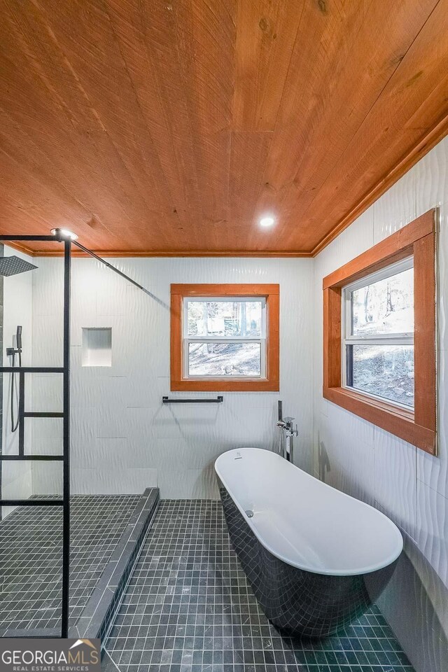 unfurnished bedroom featuring ornamental molding, dark hardwood / wood-style floors, ceiling fan, and wooden ceiling