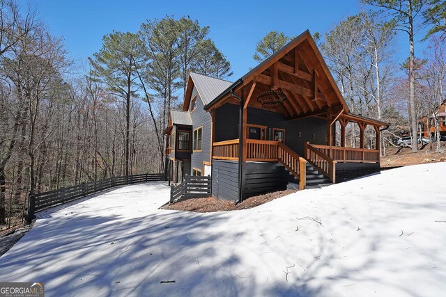 cabin featuring covered porch