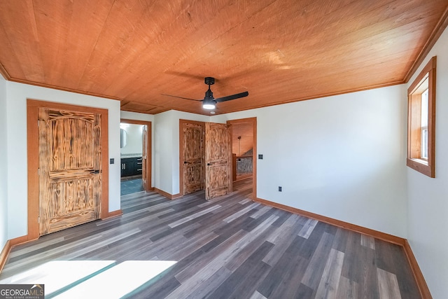 unfurnished bedroom featuring crown molding, ceiling fan, dark hardwood / wood-style flooring, and wood ceiling