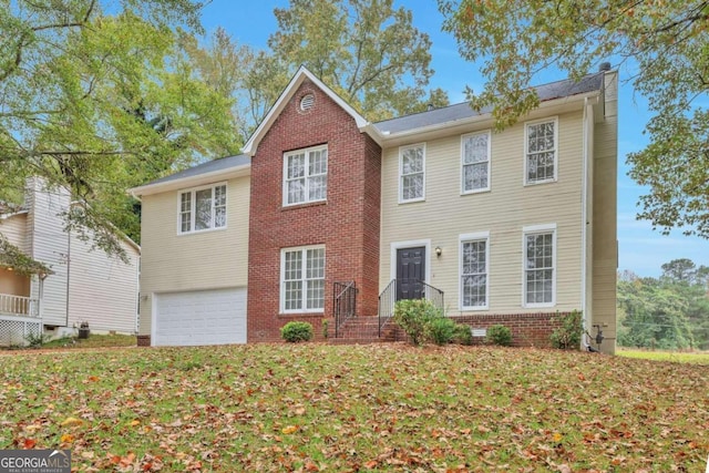 colonial-style house featuring a garage