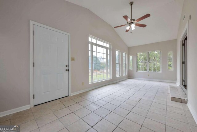 interior space with lofted ceiling, ceiling fan, and plenty of natural light