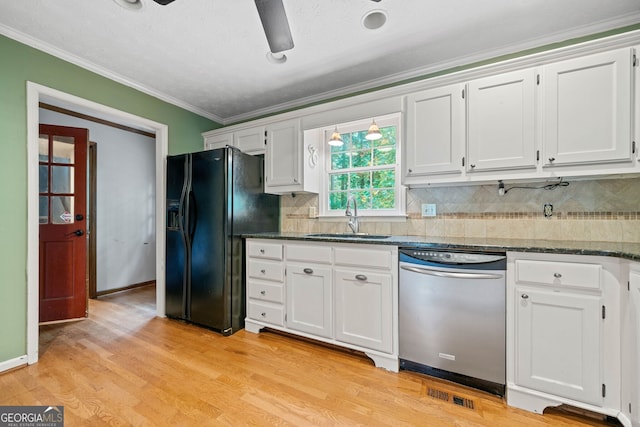 kitchen with white cabinetry, black fridge with ice dispenser, sink, light hardwood / wood-style floors, and stainless steel dishwasher