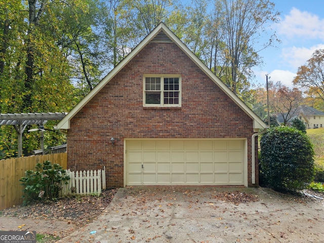 view of side of property with a garage