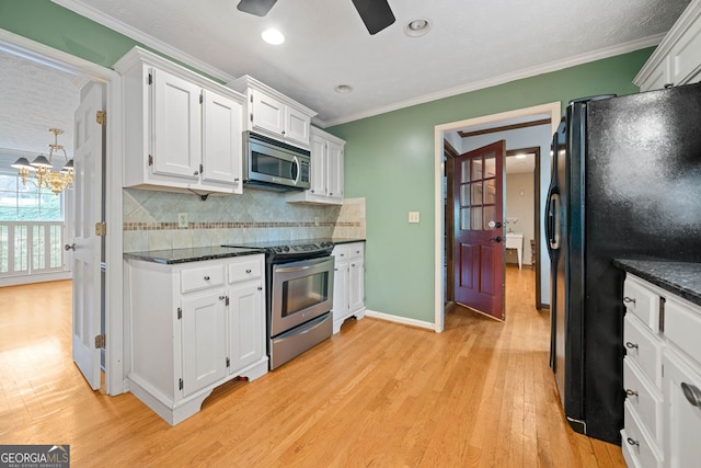 kitchen featuring white cabinetry, stainless steel appliances, crown molding, and light hardwood / wood-style flooring