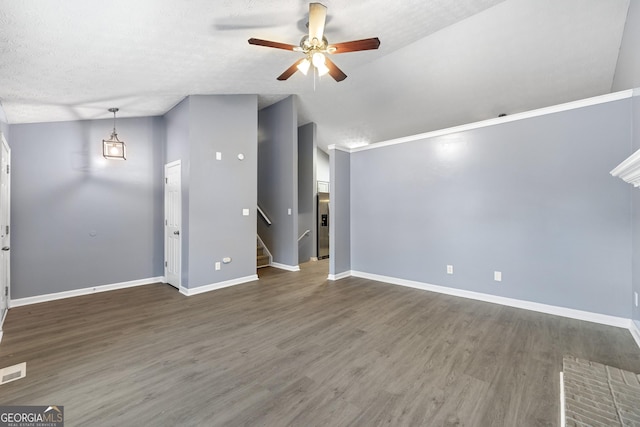 unfurnished living room featuring a textured ceiling, dark hardwood / wood-style flooring, ceiling fan, and lofted ceiling