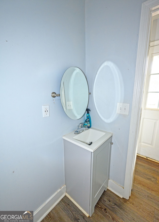 bathroom featuring hardwood / wood-style flooring and sink