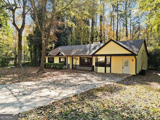 single story home featuring covered porch