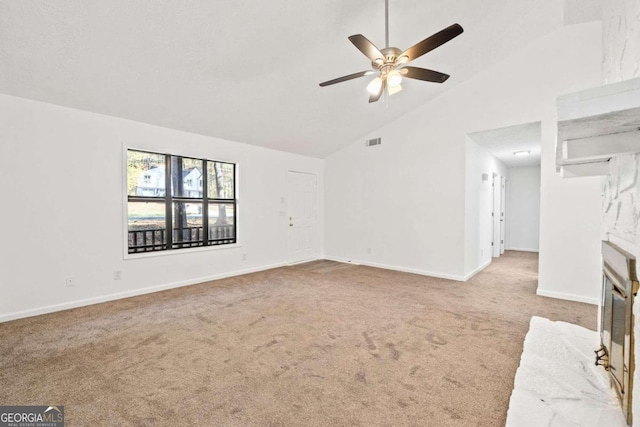 unfurnished living room featuring high vaulted ceiling, light carpet, and ceiling fan