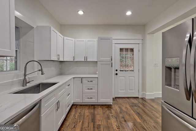 kitchen with white cabinets, sink, and stainless steel appliances