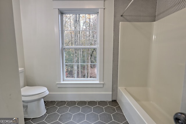 bathroom with tile patterned floors and toilet