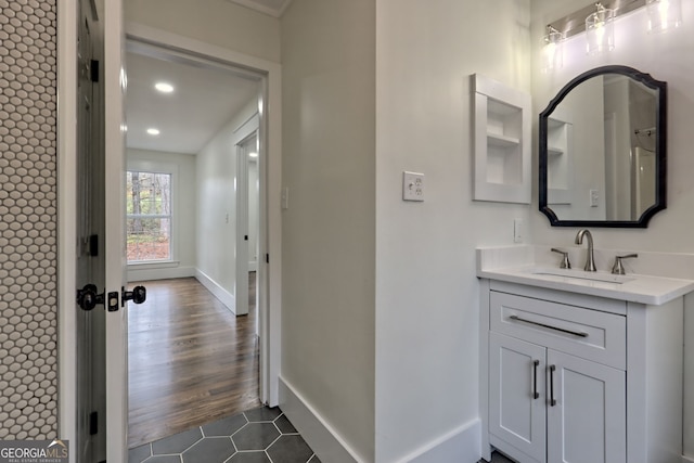 bathroom with vanity and hardwood / wood-style flooring