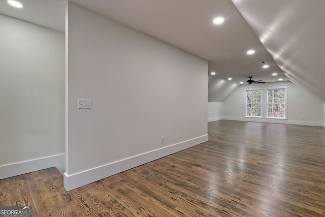 bonus room featuring lofted ceiling, dark hardwood / wood-style floors, and ceiling fan