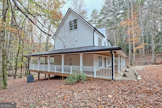 farmhouse with a porch and central AC