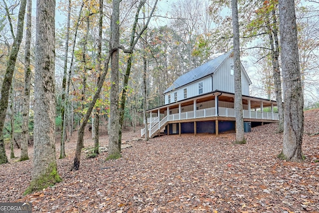 rear view of property featuring a deck