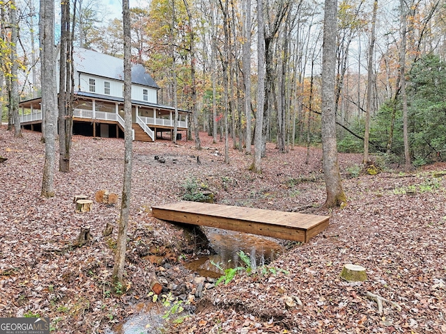 view of yard featuring a wooden deck