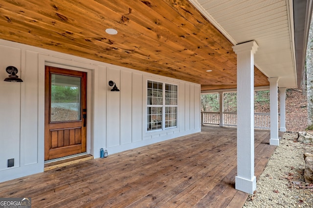 property entrance with a wooden deck