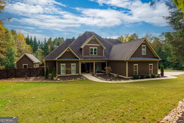 rear view of property featuring a yard