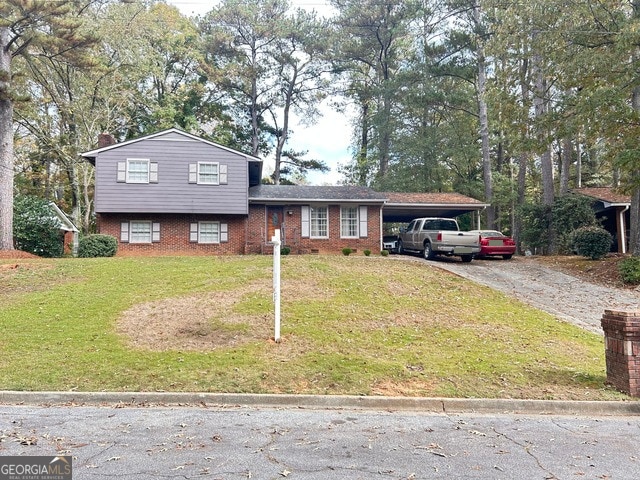 split level home with a carport and a front lawn