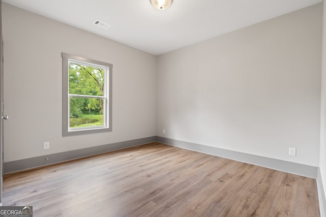 empty room with light hardwood / wood-style floors