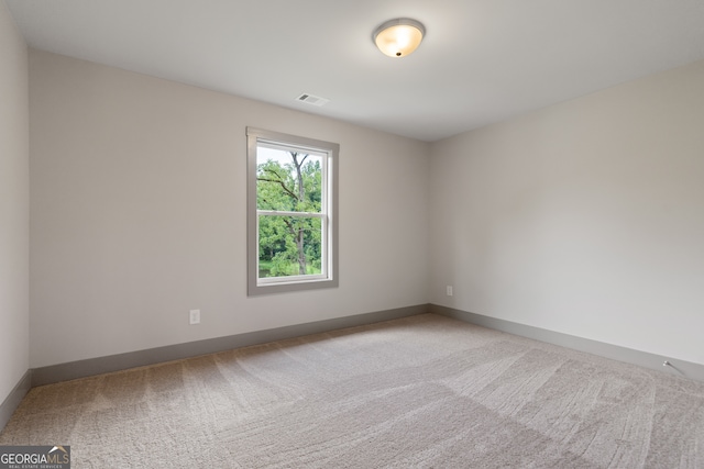 spare room featuring carpet floors