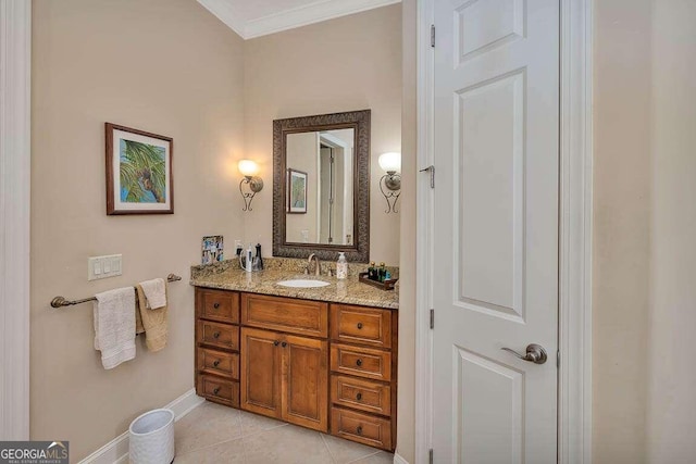 bathroom with vanity, ornamental molding, and tile patterned floors