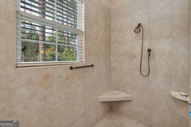 bathroom featuring tiled shower