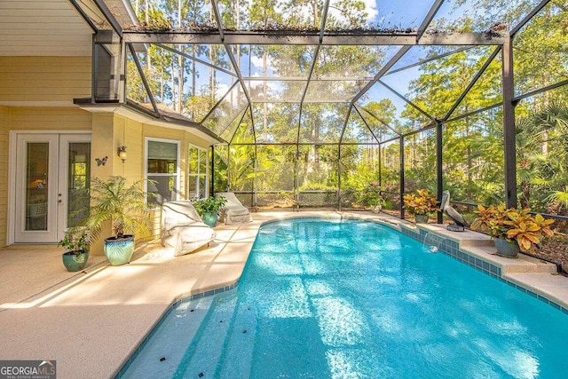 view of pool with a lanai and a patio area