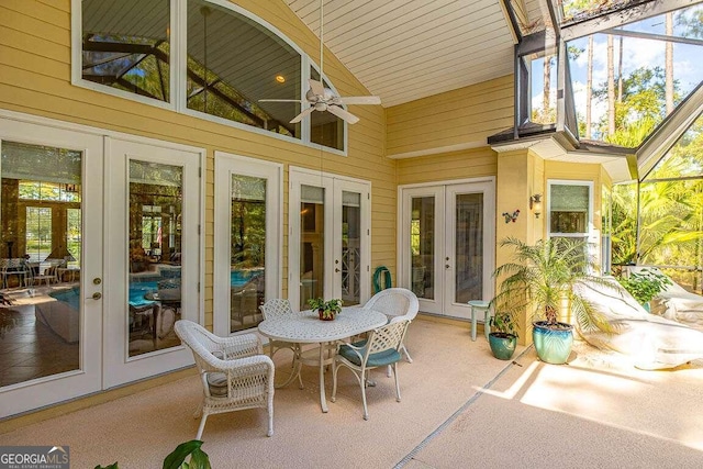 sunroom / solarium with french doors, ceiling fan, and vaulted ceiling