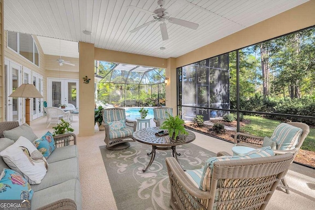 sunroom with wood ceiling and ceiling fan