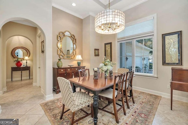 dining room featuring crown molding, light tile patterned floors, and an inviting chandelier