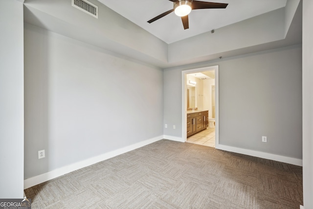 carpeted empty room featuring ceiling fan