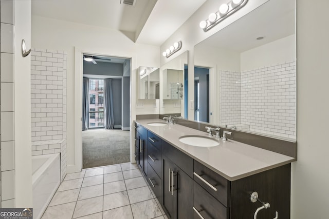 bathroom with vanity, ceiling fan, and tile patterned flooring