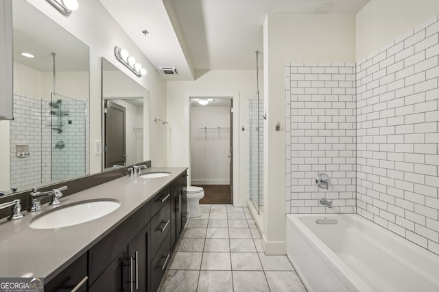 full bathroom with tile patterned flooring, vanity, toilet, and independent shower and bath