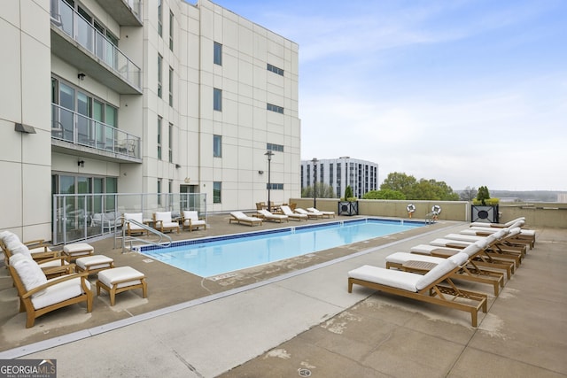 view of swimming pool featuring a patio